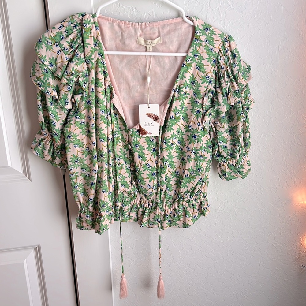A pink top with green floral print!